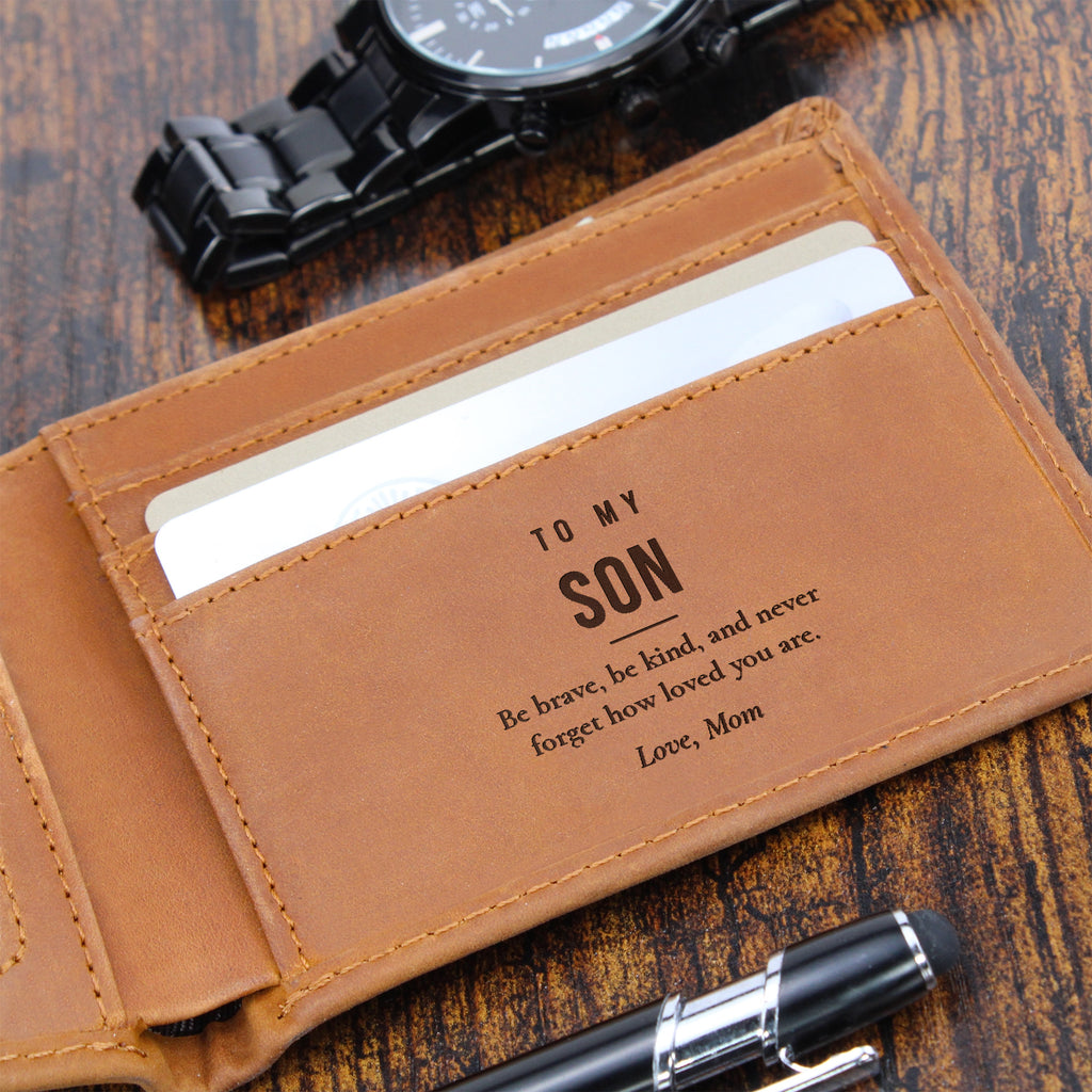 Close-up of brown engraved leather wallet with To My Son message beside a watch