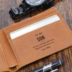 Close-up of brown engraved leather wallet with To My Son message beside a watch