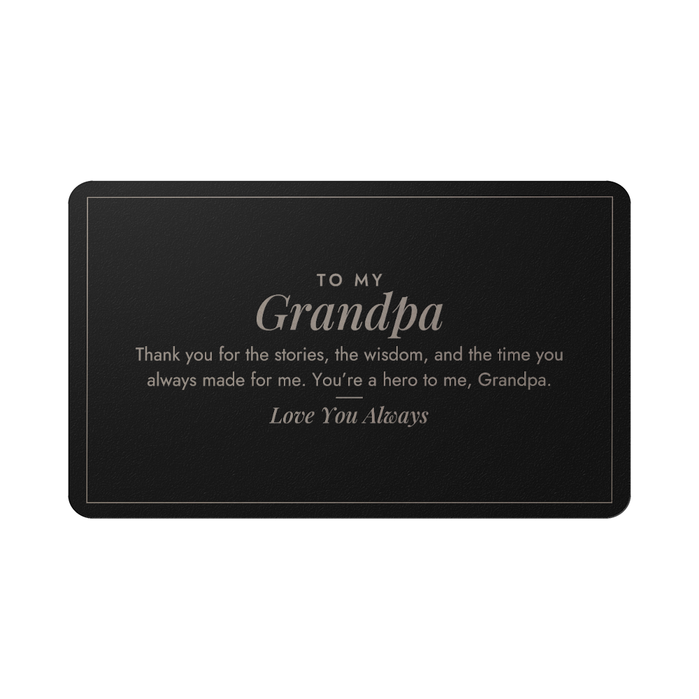 Engraved metal wallet card for grandpa held in hand
