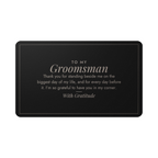 Engraved metal wallet card for groomsman held in hand