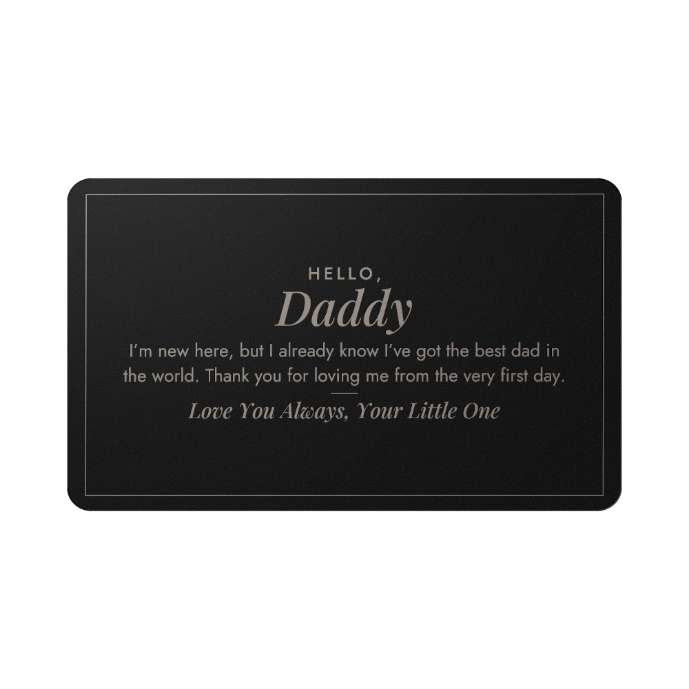 Engraved metal wallet card for new dad held in hand