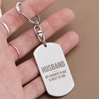 Engraved dog tag keychain for Husband, stainless steel close-up in hand