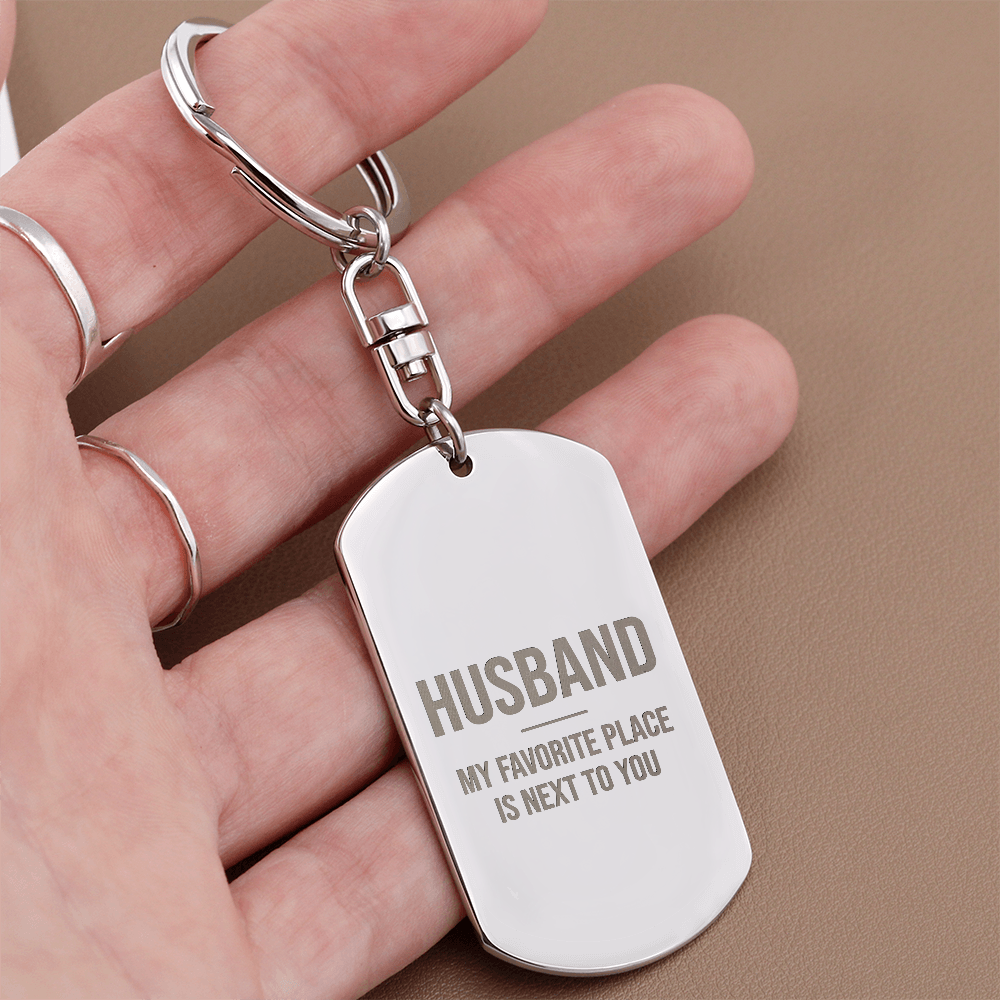Engraved dog tag keychain for Husband, stainless steel close-up in hand