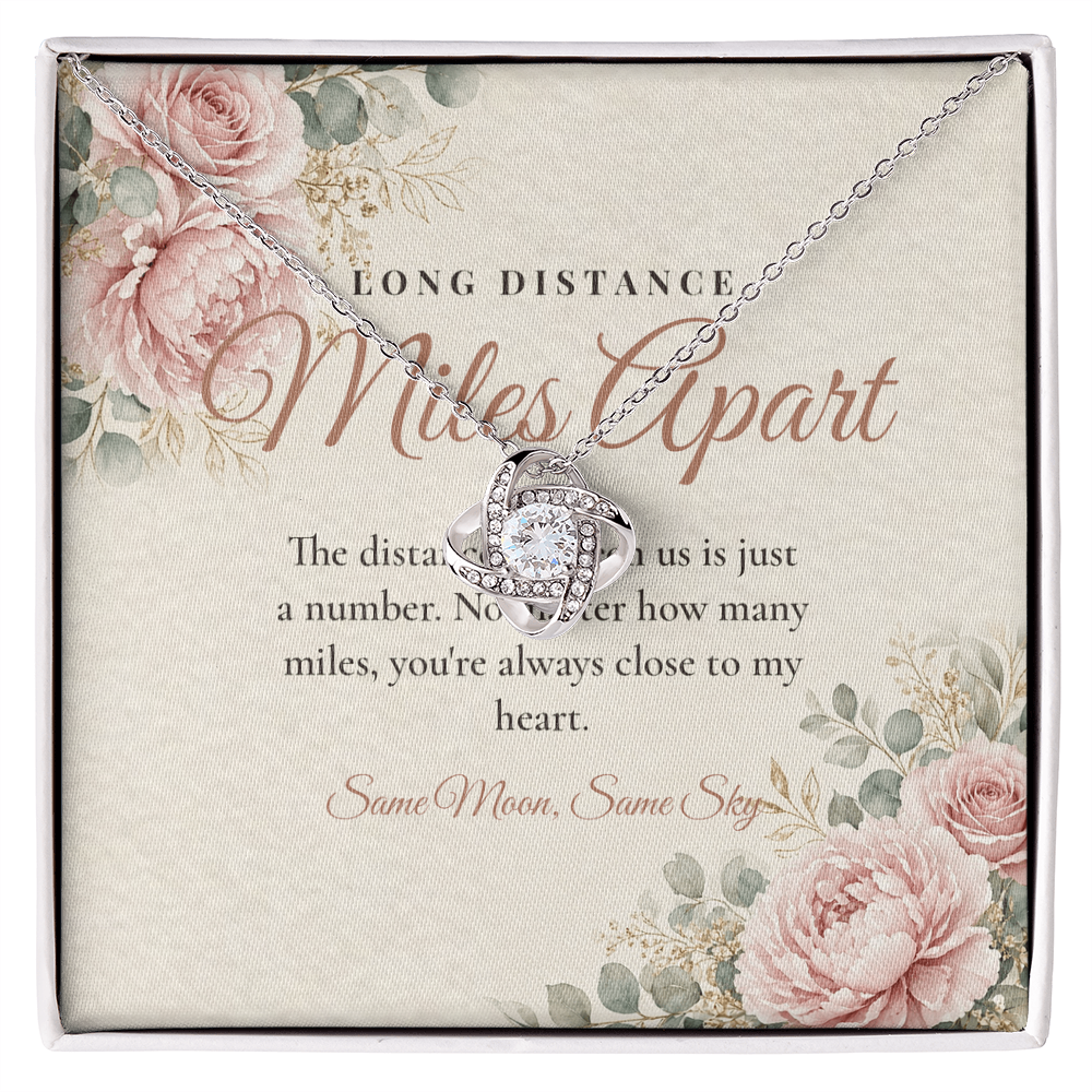 Silver Love Knot necklace for long distance best friend displayed on Long Distance Miles Apart message card
