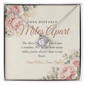 Silver Love Knot necklace for long distance best friend displayed on Long Distance Miles Apart message card
