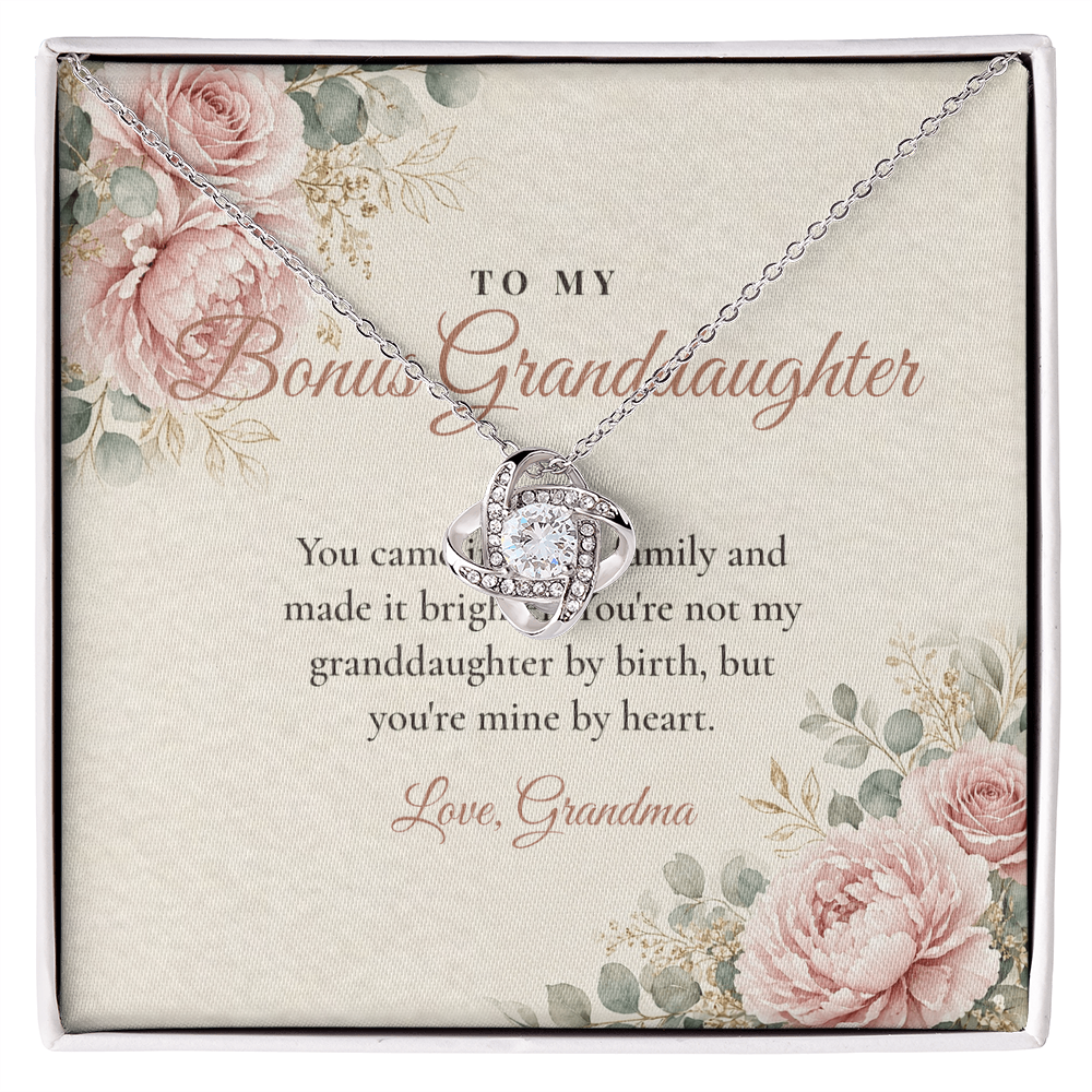 Silver Love Knot necklace for bonus granddaughter displayed on To My Bonus Granddaughter message card