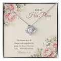 Christian Love Knot necklace laid on "Trust His Plan" Romans 8:28 message card