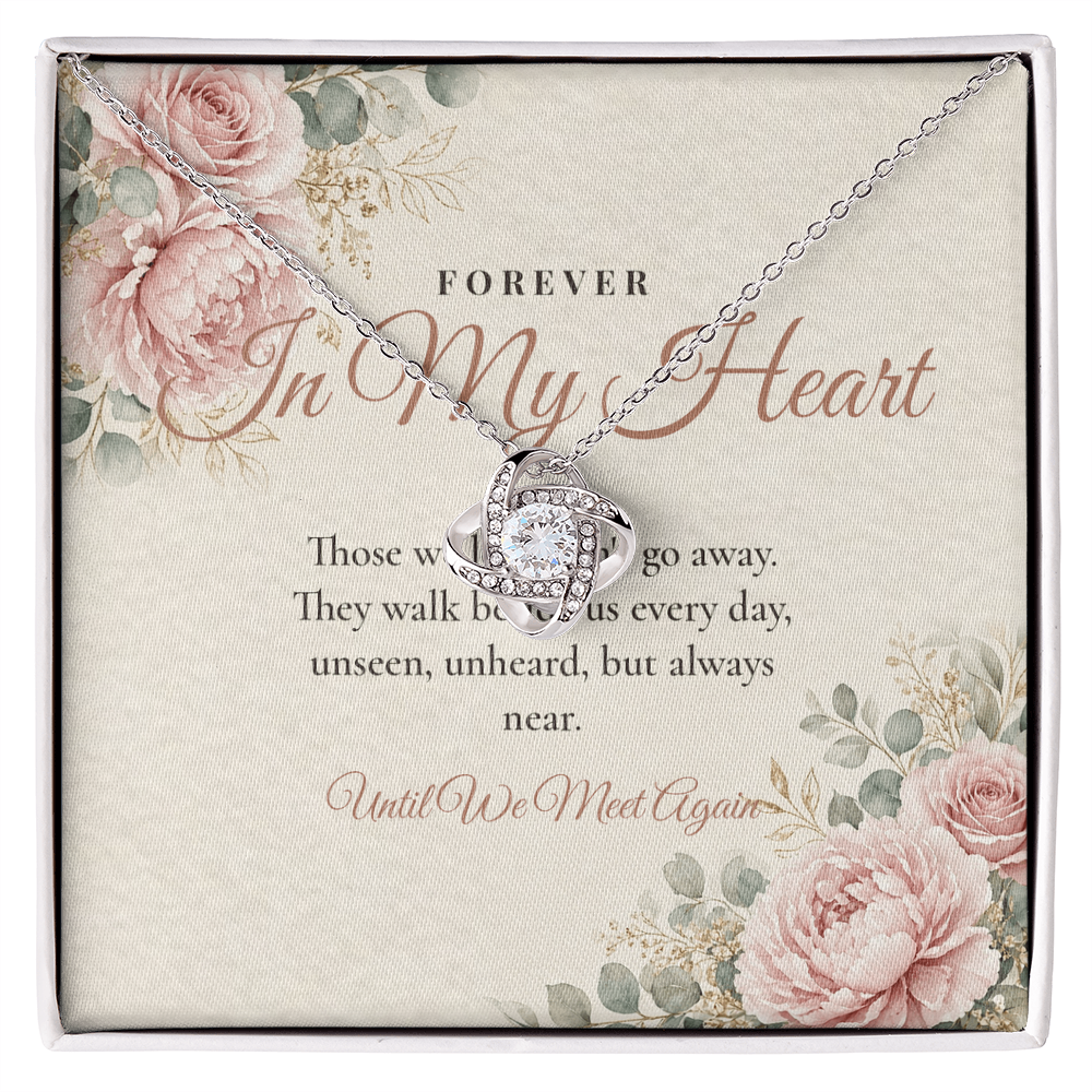 Silver memorial Love Knot necklace displayed on Forever In My Heart message card