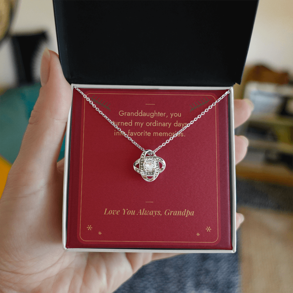 Hand holding gift box with white gold Love Knot necklace for granddaughter from Grandpa and Favorite Memories message card