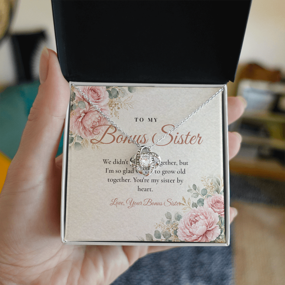 Hand holding gift box with silver Love Knot necklace for bonus sister and To My Bonus Sister message card