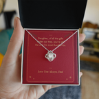 Hand holding gift box with white gold Love Knot necklace for daughter from Dad and Under Our Tree message card