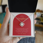 Hand holding open gift box with 14K white gold finish Love Knot necklace for Daughter and modern message card