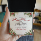 Hand holding gift box with silver Love Knot necklace for best friend and To My Best Friend message card