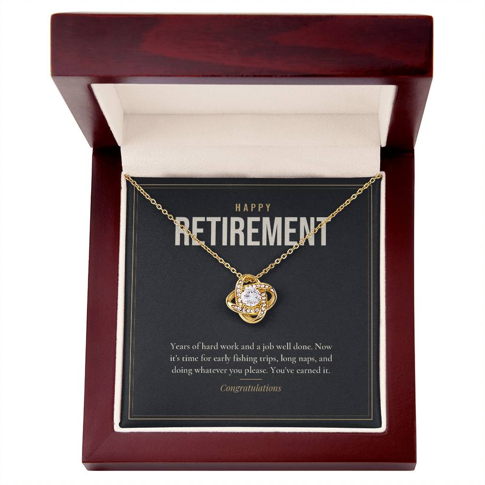 18K yellow gold finish Retirement Love Knot necklace for Him in mahogany luxury gift box with lid open, "Happy Retirement" message card