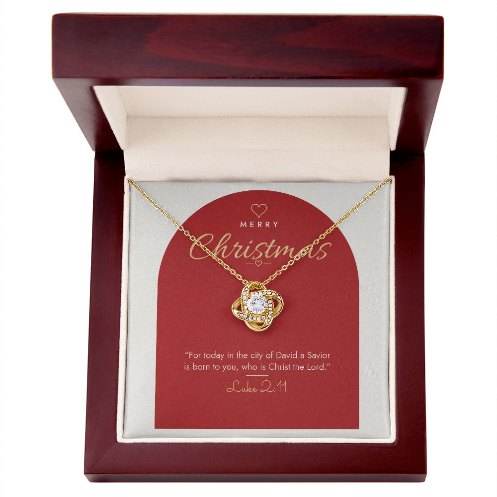 18K yellow gold finish Christian Christmas Love Knot necklace in mahogany luxury gift box with lid open, "Merry Christmas" Luke 2:11 modern message card