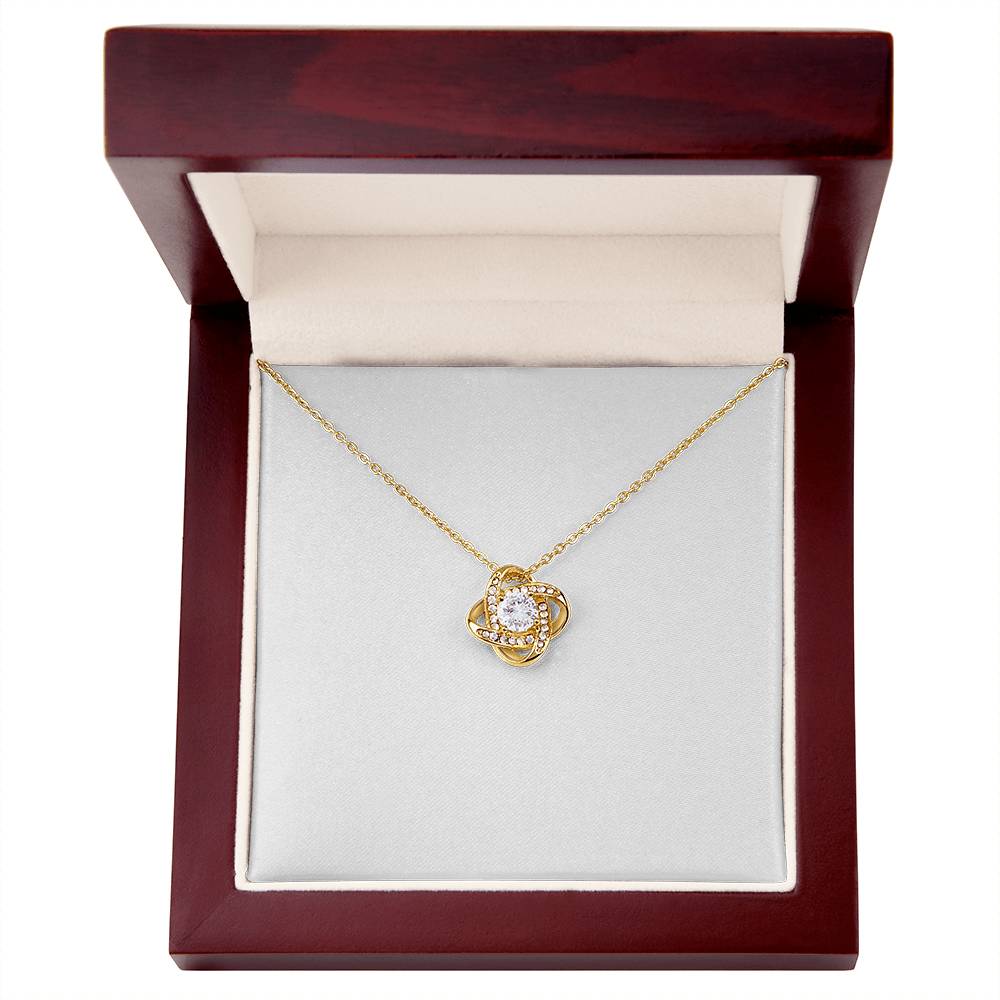 18K yellow gold finish Christian Christmas Love Knot necklace in mahogany gift box with lid open, "O Holy Night" John 3:16 message card