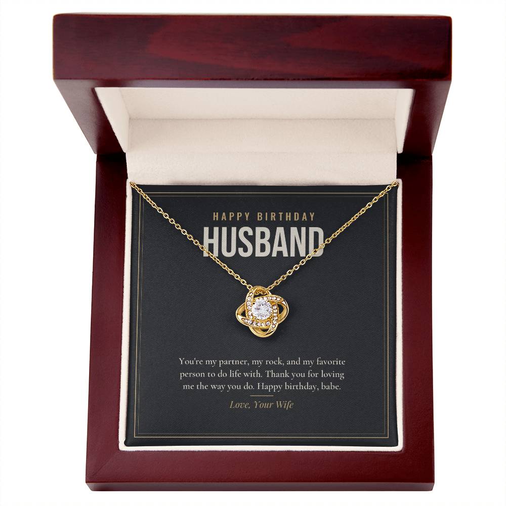 18K yellow gold finish Birthday Love Knot necklace for Husband in mahogany luxury gift box with lid open, "Happy Birthday Husband" message card