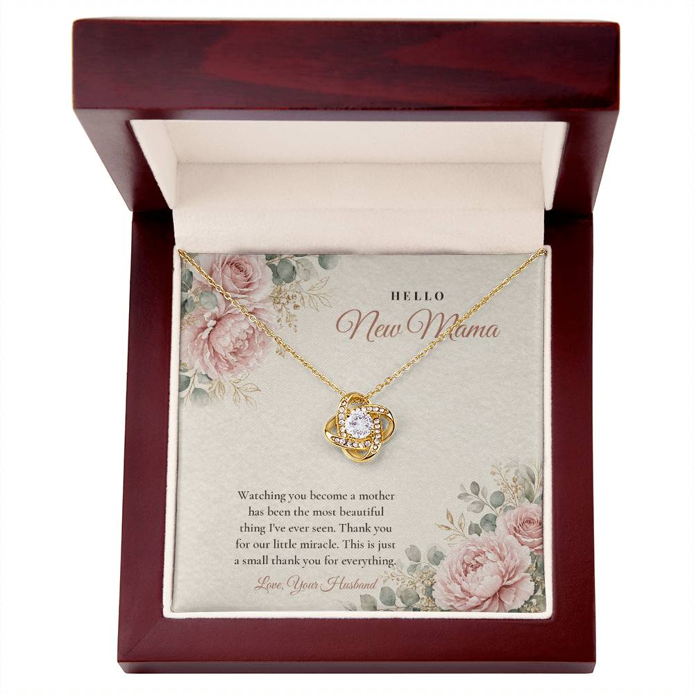 18K yellow gold finish Push Present Love Knot necklace for New Mom in mahogany luxury gift box with lid open, "Hello New Mama" message card
