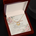 Yellow gold Love Knot necklace for daughter and To My Daughter Jeremiah 29:11 message card in open mahogany luxury box on dark background