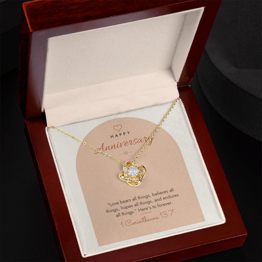 18K yellow gold finish Christian Love Knot necklace for Anniversary in open mahogany luxury box with LED spotlight, 1 Corinthians 13:7 modern message card