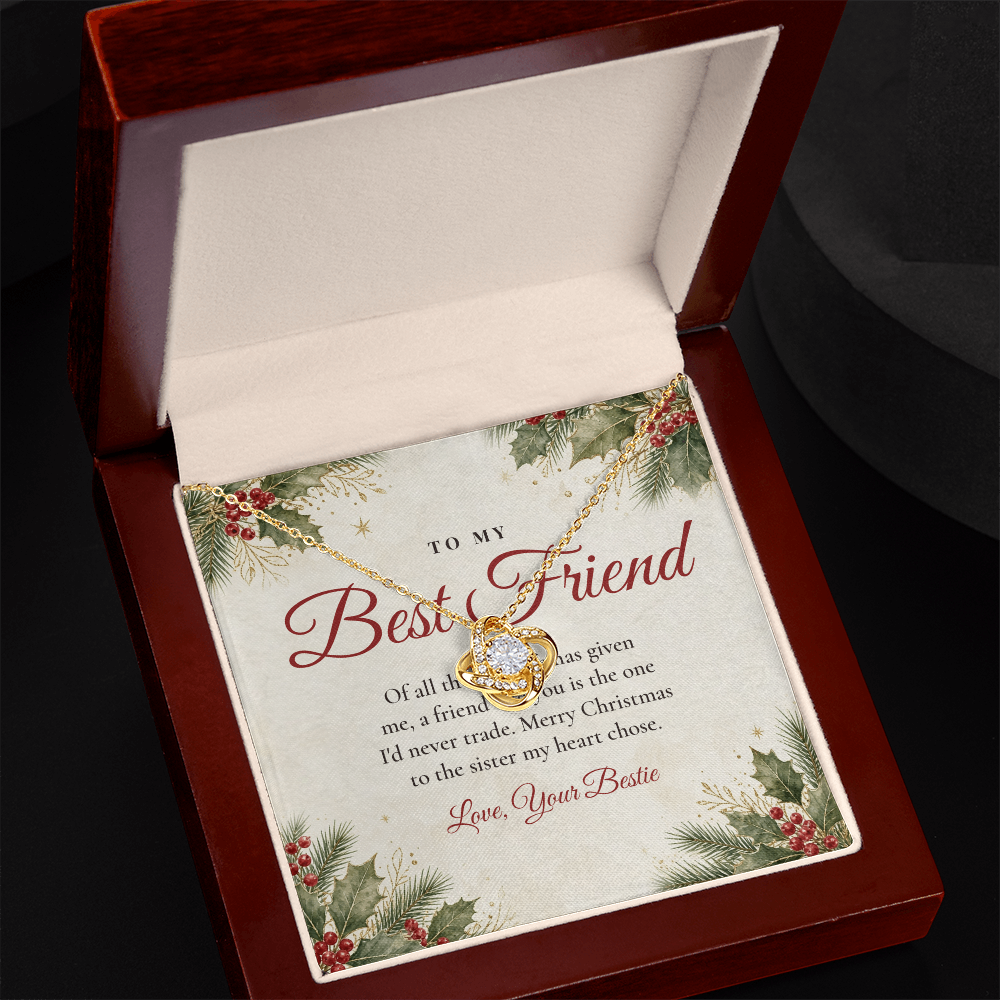 Yellow gold Love Knot necklace for best friend and To My Best Friend message card in open mahogany luxury box on dark background
