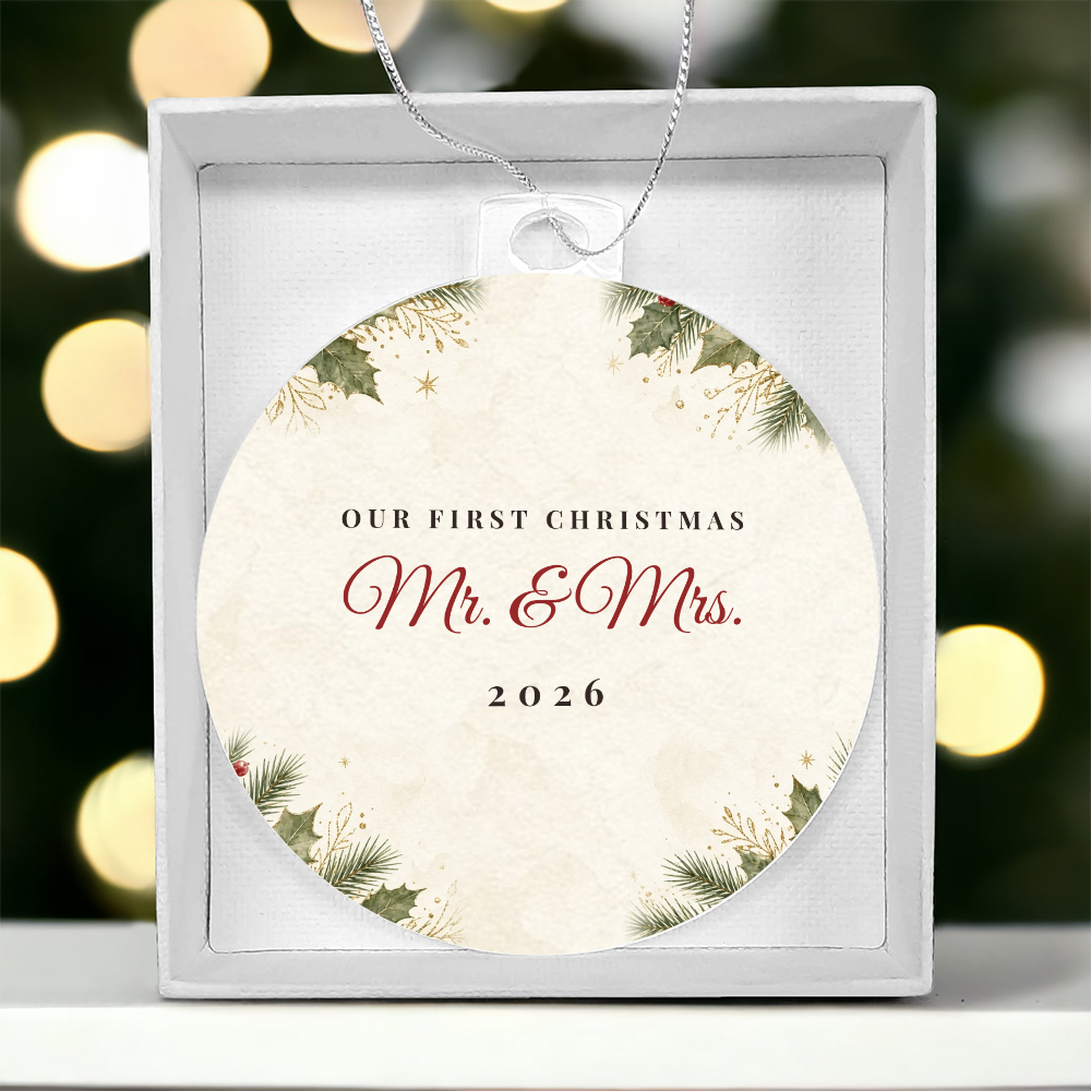 Acrylic bulb ornament with Our First Christmas Mr. & Mrs. 2026 design in gift box with Christmas lights