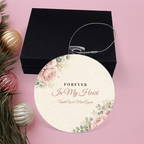 Acrylic bulb ornament with Forever In My Heart design with black gift box on pink background