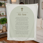 Woman holding the Mother's Prayer for My Son sage fleece blanket in a living room