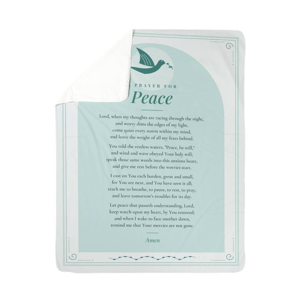 Teal peace prayer blanket with folded corner showing soft sherpa back