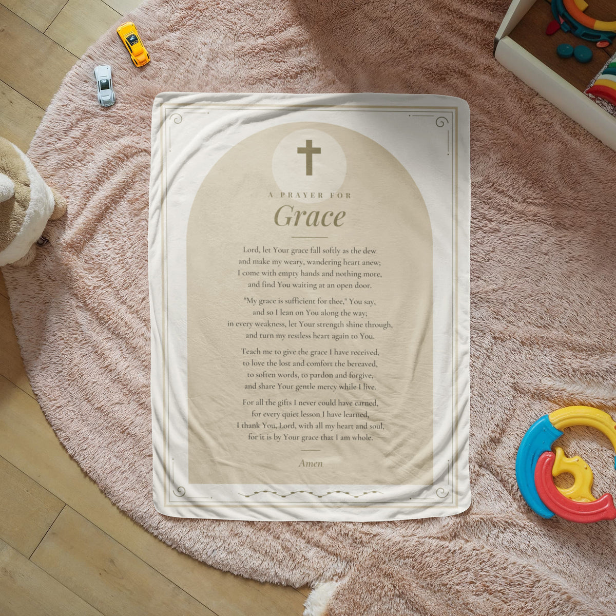 Tan grace prayer blanket with printed prayer spread on a cozy rug