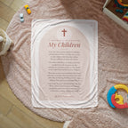 Blush mothers prayer blanket with printed prayer spread on a cozy rug