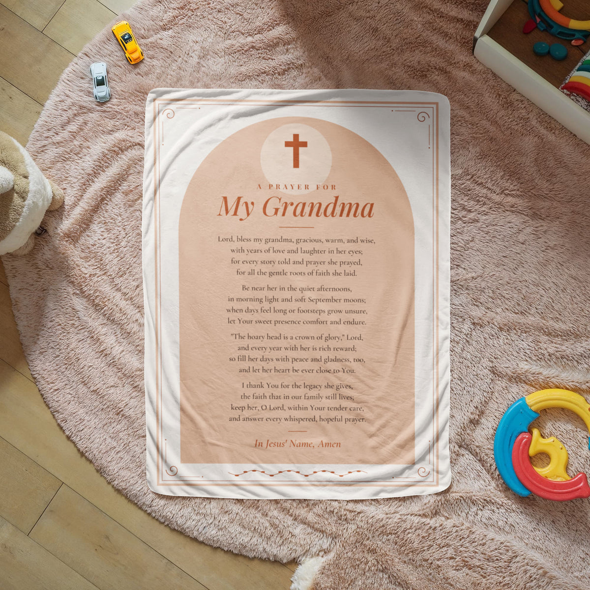 Peach prayer blanket for grandma with printed prayer spread on a cozy rug