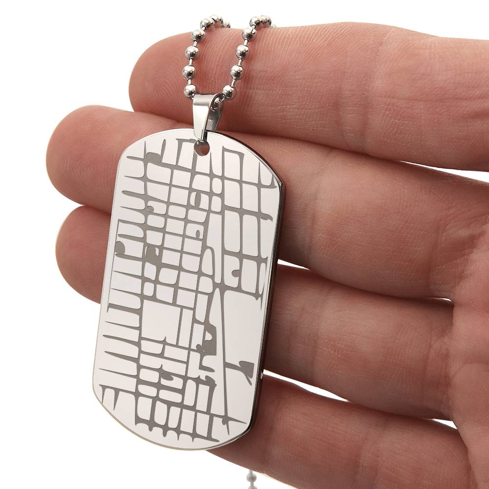 Engraved map dog tag necklace for him, stainless steel held in hand