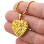 Engraved heart map necklace, 18k gold finish held in hand