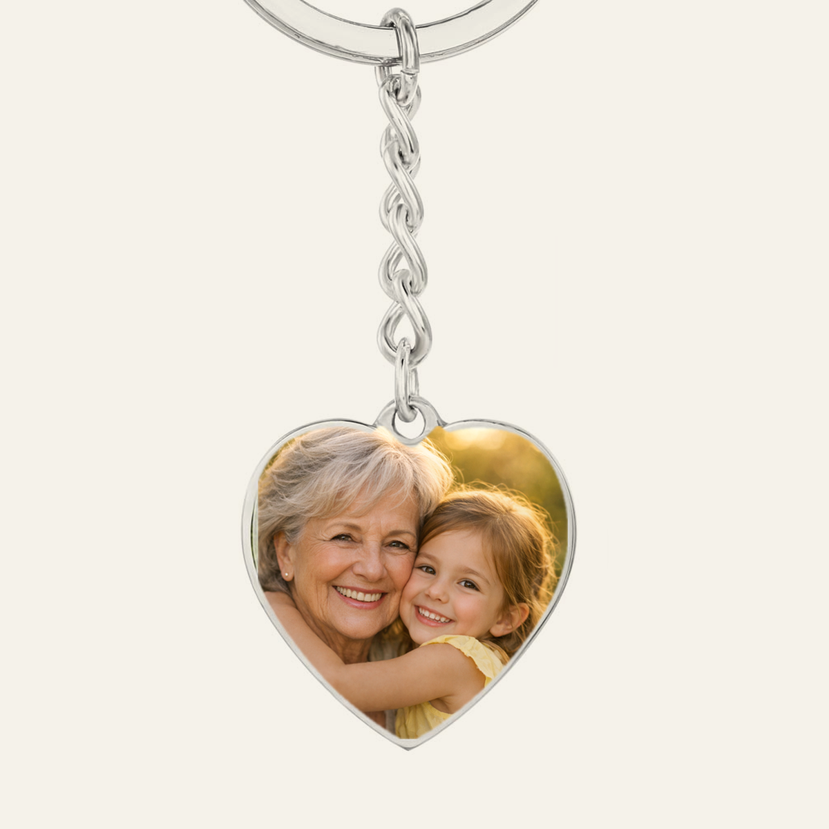 Custom photo heart keychain for Grandma, example with a grandmother and granddaughter photo printed on the heart pendant
